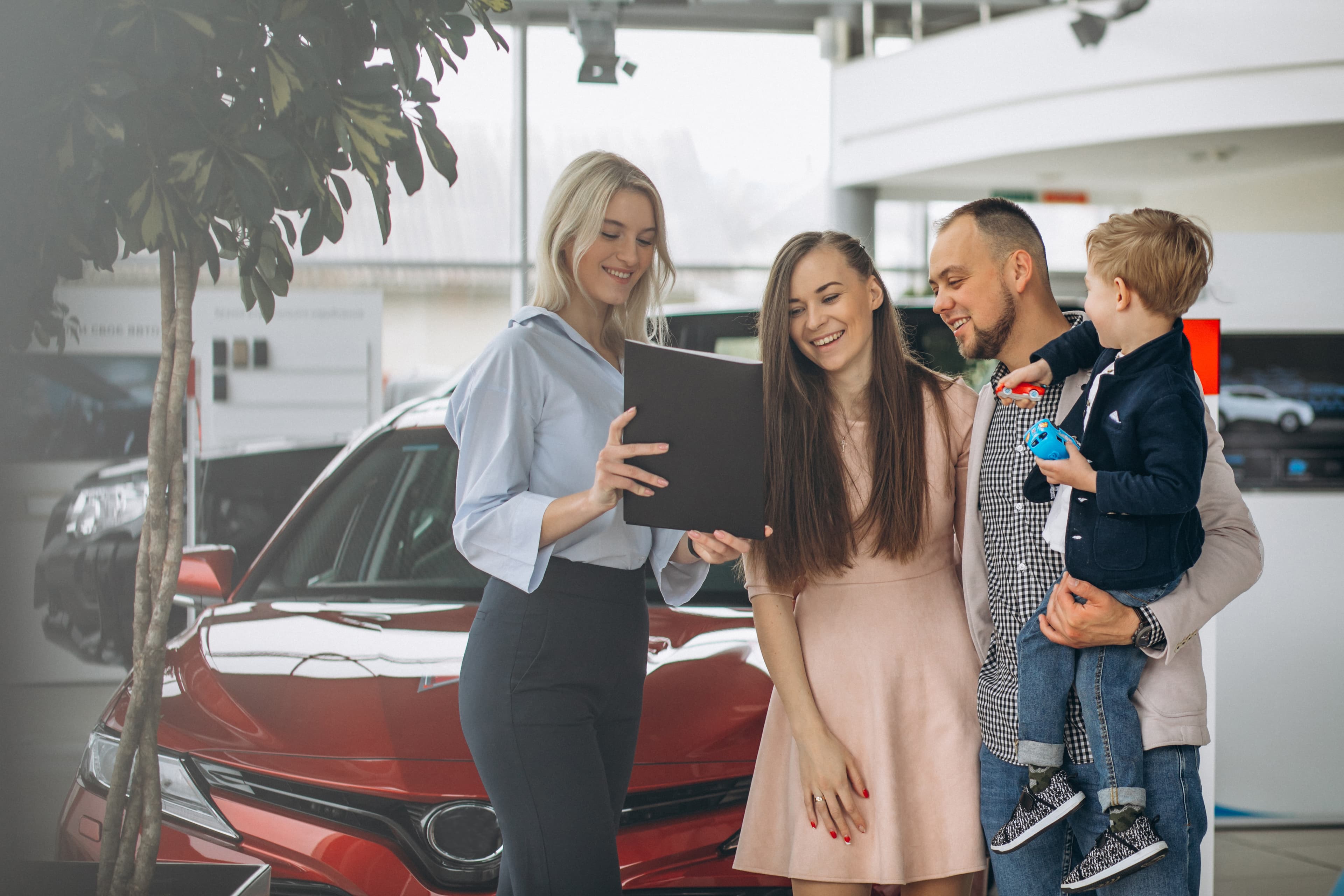 Family choosing a car at Diamond II Auto Sales